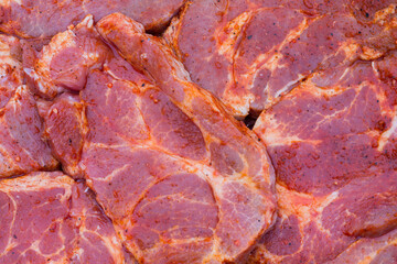 Raw uncooked pork steaks. Marinated pork neck with the addition of spices ready to be grilled, bbq, barbecue