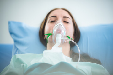 disease woman patient wearing medical oxygen mask and treatment in hospital, medicine health...