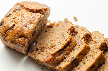 Freshly made spiced fruit  loaf cake  on the white  background
