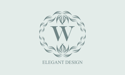 Elegant floral monogram with exquisite elements. Template for invitations, labels, business signs. Vintage ornament with calligraphic letter W.