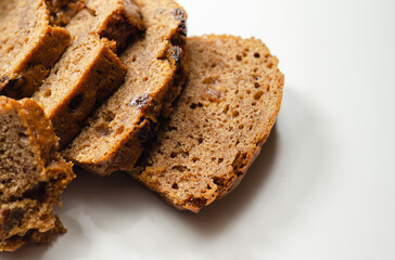 Freshly made spiced fruit  loaf cake  on the white  background