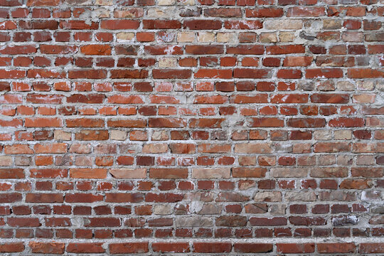 Fototapeta Old grunge brick wall with rustic look full frame as background banner with copy space for runaround or wraparound text 