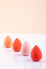 Colorful beauty sponges. Makeup tool for applying and blending products such as foundation, concealer. Copy space for text.