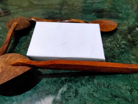 mockup concept with two wooden spoons background