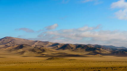 desert landscape on a bright sunny day, showing the clouds moving overhead.