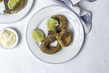 Typical Spanish frying of fried fish with lemon