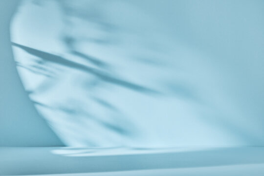 Abstract blue background with drop shadow and light. Backdrop for product presentation