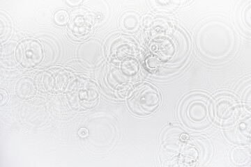 Water background. White transparent water texture, blue mint water surface with rings and ripple. Spa concept background. Flat lay, top view, copy space, copy-space, place for text.