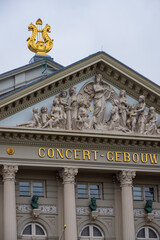 April 28, 2021, Amsterdam, Netherlands, Facade with religious reliefs of the Concertgebouw (concert hall) in Amsterdam, Netherlands, 19th century Neoclassical style