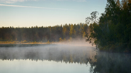 Fototapeta na wymiar Dawn Lake Landscape. Fog over the water. Views of Russia