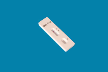closeup of test cassette on a blue background, medical disposable sterile antigenic test kit for antigenic rapid test covid-19, early detection of viral disease
