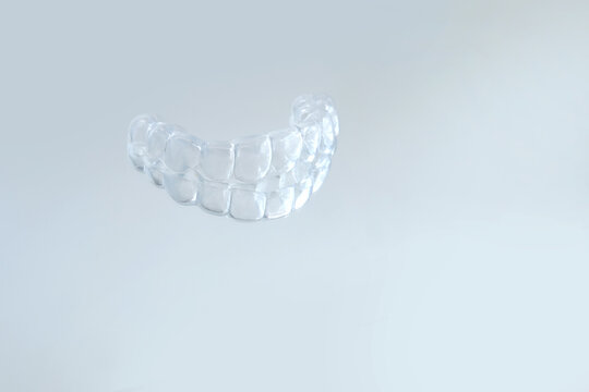 close-up of transparent Silicone Night Mouth Guard for Teeth Clenching Grinding Dental Bite Sleep Aid, concept dental services, remedy for grinding teeth, oral care