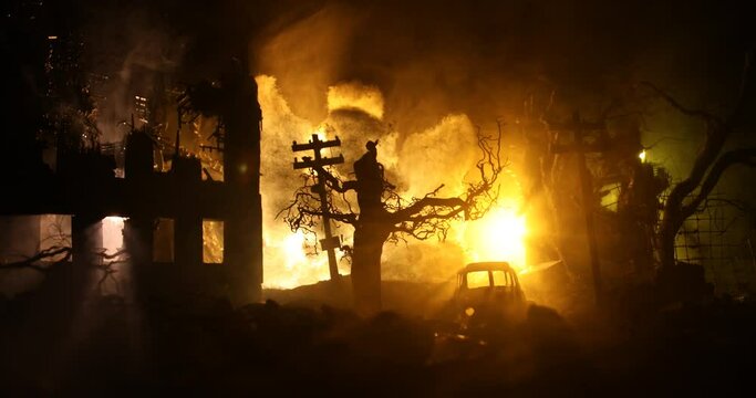 War Concept. Military silhouettes fighting scene on war fog sky background, World War Soldiers Silhouette Below Cloudy Skyline At night. Battle in ruined city. Selective focus