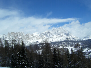 Obraz premium A landscape and cloudscape of the astonishing Italian Alps after a big snowfall.