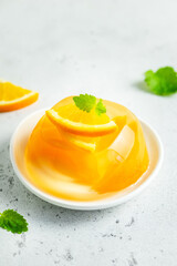 Light summer orange citrus jelly dessert. Space for text.