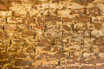 Old brick wall background. Yellowish bricks.