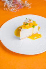 Cheesecake on a white plate in a restaurant serving