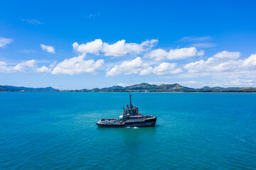Aerial view of tug boat in the ocean