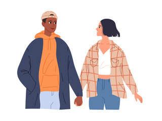 Couple of teenagers in love on a date walk holding hands