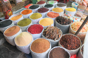 A vibrant, colourful, traditional Vietnamese spice market on the city streets of Hanoi.