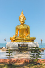 Gold giant buddha statue, a monument commemorating victims of tsunami at Ban Nam Khem Tsunami Memorial Center Park in Takua Pa, Thailand.