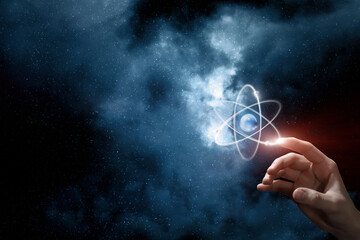 Hand clicks on an atom.