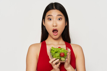 woman of asian appearance plate with salad healthy food