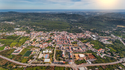 Aerial view from the sky of the Portuguese village of Sao Bras de Alportel, overlooking the Atlantic Sea. Portugal Algarve