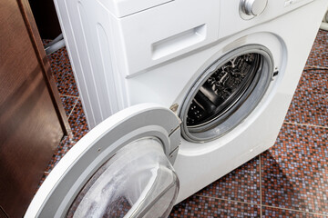 washer indoors bathroom. close up view. appliance repair concept