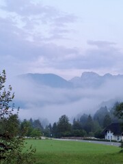 Fogy morning over montain landscape, dawn, clouds, Slovenia, Bohinj, Julian Alps