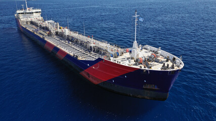 Naklejka premium Aerial drone photo of crude oil tanker carrier anchored in deep blue open ocean sea