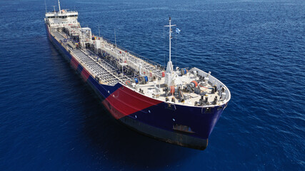 Naklejka premium Aerial drone photo of crude oil tanker carrier anchored in deep blue open ocean sea