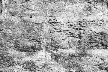 Texture of a concrete wall with cracks and scratches which can be used as a background