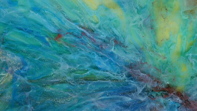 Abstract light pastel streams flow along the plane on a blue background. Marble texture. Fluid art. Liquid abstractions.