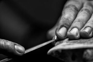 Goldsmith's hands at work, handmade jewelery