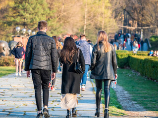 Many people out for a walk or stroll in King Mihai I Park (herestrau). Busy day in the park