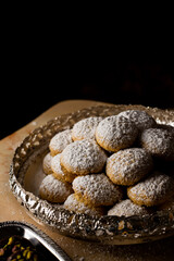 Eid Cookies, a traditional type of cookies that is usually served and made in Eid Alfitr Almubarak after the end of Ramadan month. 
We usually splatter sugar on it.  