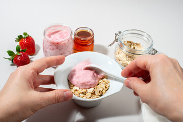 Woman hands making homemade cosmetics.