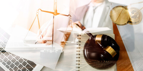 justice and law concept.Male judge in a courtroom on wooden table and Counselor or Male lawyer working in office. Legal law, advice and justice concept.