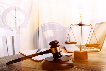 Business and lawyers discussing contract papers with brass scale on desk in office. Law, legal...