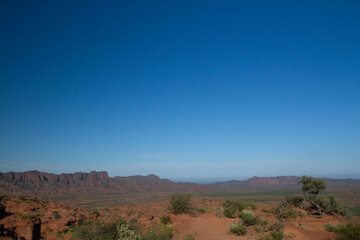 Beautiful emptiness. The arid desert, red sand and mountains under a deep blue sky. 
