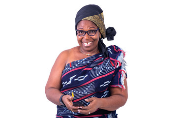 close-up of a beautiful African woman in traditional dress with cellphone, smiling.