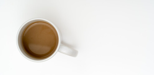 Top view, flat lay of black coffee cup on background white.