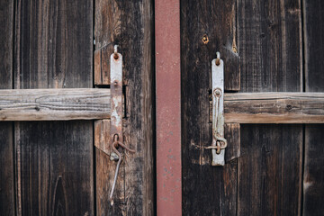 Old metal hook for closing wooden doors