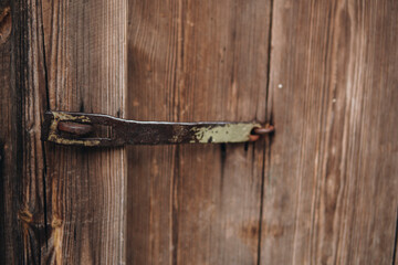 old metal closing in front of vintage doors