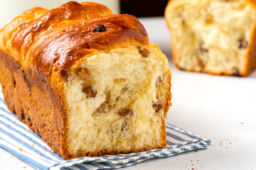 Homemade cake closeup. Sweet cake from yeast dough with raisins. Homemade baking.
