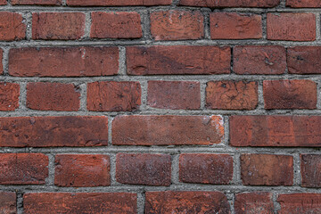 abstract background of an old red brick wall close up
