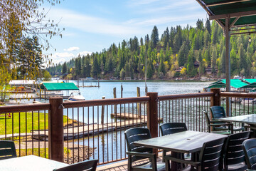 A waterfront cafe patio overlooking a community of homes and docks on the lake at Rockford Bay in...