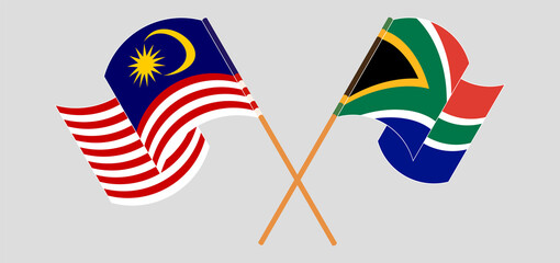 Crossed and waving flags of Malaysia and Republic of South Africa