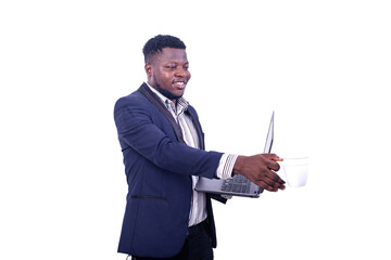 young businessman holding a laptop and taking a cup of coffee.